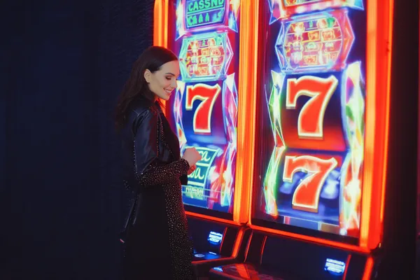 A woman in a luxurious green gown next to an ornate roulette wheel, capturing the upscale casino mood of SPORTYBEF.