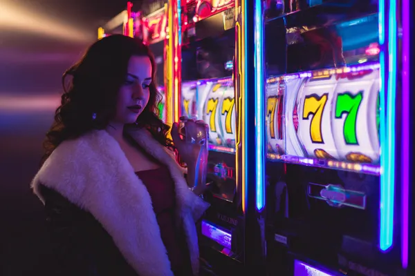 A player using their smartphone during a festive local event, representing SPORTYBEF’s fully mobile-friendly casino.